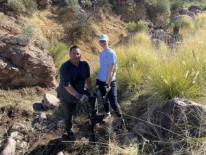 Father-Daughter removing invasive plants